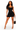A woman modeling a black halter-neck bodycon mini dress, holding a small black handbag with gold-tone handles, against a plain white studio background.