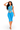 A woman modeling a bright blue two-piece activewear set consisting of a strappy cutout crop top and matching high-waisted capri leggings, set against a plain white background.