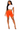 Woman wearing a white crop top and orange shorts on a white background
