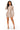 A woman modeling a long-sleeve knit mini dress with vertical taupe and cream stripes and side cutouts, paired with clear high-heeled sandals, against a plain white background.