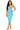 Woman wearing a light blue dress with button details on a white background