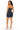 A woman modeling a dark blue denim bodycon mini dress from the back, featuring thin spaghetti straps, a zippered back, and a mid-thigh length silhouette, set against a plain white background.