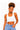 A woman modeling a white scoop-neck crop top with light blue jeans against a plain white background.